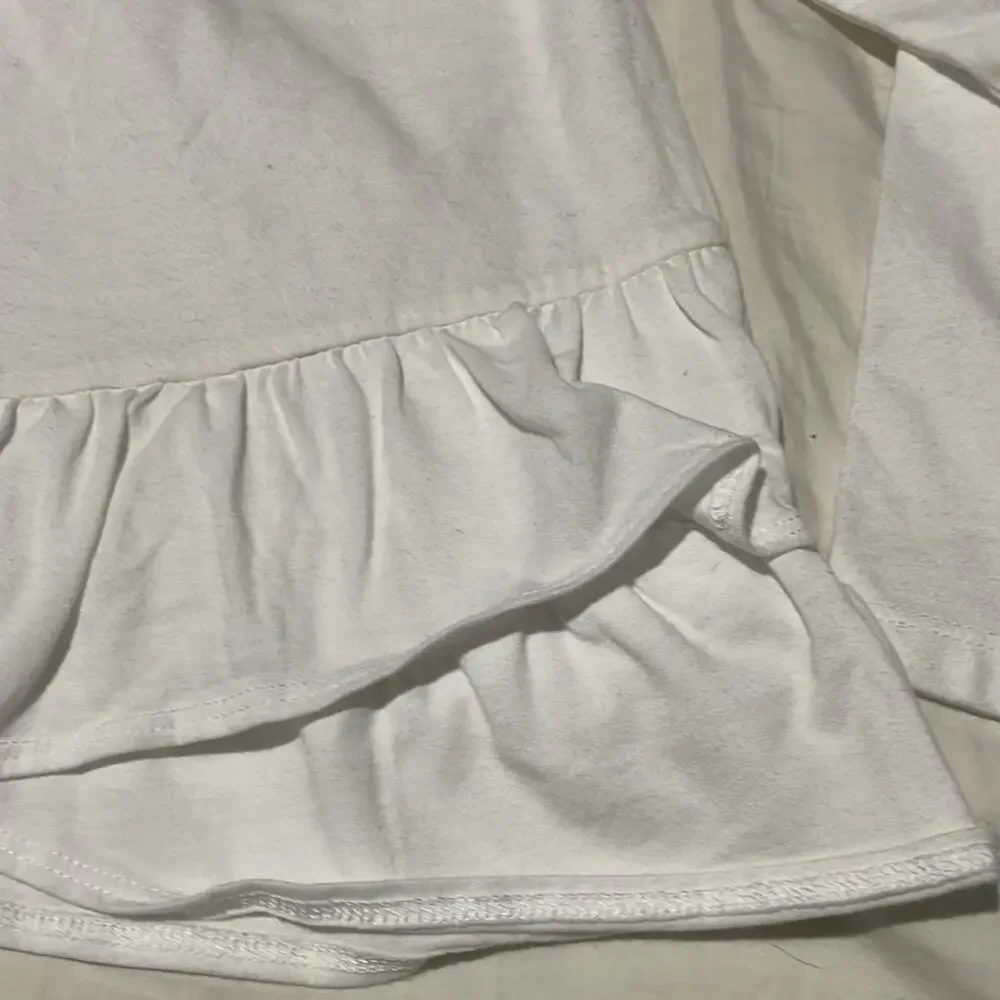 Oshkosh by gosh 6/6x white long sleeve offset ruffled hem t euc